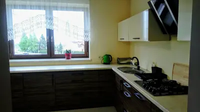 a bedroom with two beds and a lamp on a night stand at Leo House in Gaj