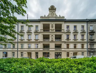 a large building with a tower on top of it at Apartamenty Amber in Kraków