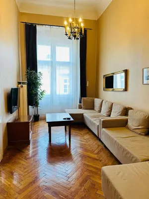 a living room with a couch and a table at Main Market Square Apartments in Kraków