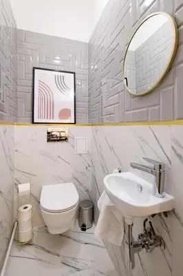 a bathroom with a sink and a toilet and a mirror at WAWELOVE spacious 3 bedroom apt 1 min to Main Sq! in Kraków