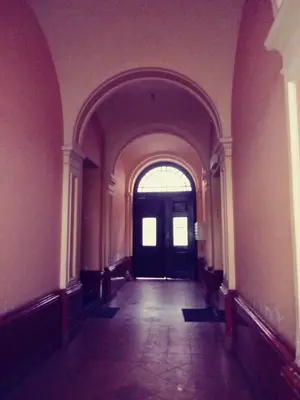 an empty hallway with a door in a building at AP Na Groblach in Kraków