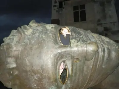 a child is inside a large metal car at AP Na Groblach in Kraków