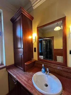 a bathroom with a sink and a mirror at Royal in Kraków