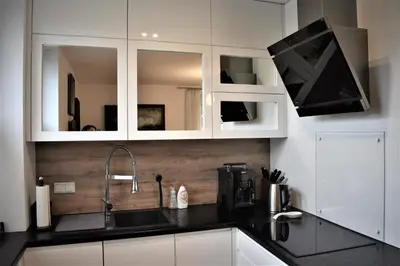 a living room with a flat screen tv on a wall at Apartament u Janka in Wieliczka