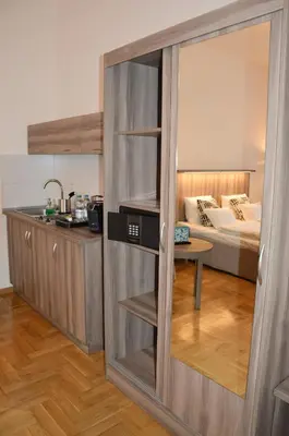 a sliding glass door in a room with a bed at Kosmopolita Apartments in Kraków