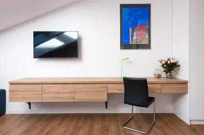 a wooden desk in a room with a chair at Old Town, Kazimierz, large luxurious, 2 bedroom 2 bathroom, Airco in Kraków