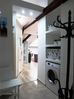 a laundry room with a washer and dryer at Apartament krakowski GIMO na Kazimierzu in Kraków