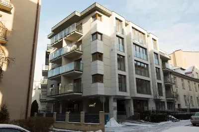 an apartment building in front of a street at Chopin Apartments in Kraków