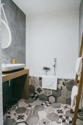 a bathroom with a sink and a tile floor at Eight Lux View in Old Town and Free Parking in Kraków