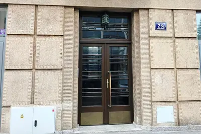 a building with a large wooden door on it at Apartment III GrayFor2 Old Town Kraków in Kraków