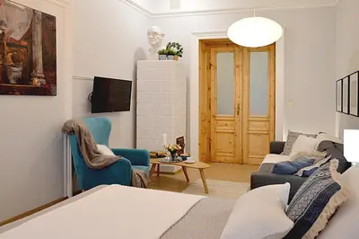 a living room with a couch and two chairs at Art Apartments w centrum Krakowa (Śródmieście, Stradom) in Kraków
