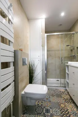 a bathroom with a shower and a toilet and a sink at Otium Old Town Sarego in Kraków