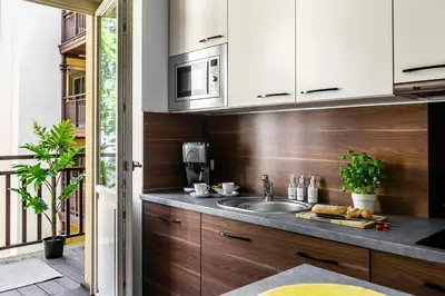 a kitchen with a sink and a microwave at Otium Old Town Sarego in Kraków