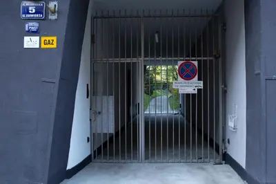 a gate in the side of a building at Amazing Apartment, City Centre, Modern, Elegant, Cozy in Kraków