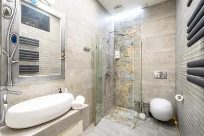a bathroom with a sink and a shower at RentPlanet - Studio Krasińskiego in Kraków