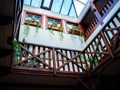an overhead view of a building with windows and potted plants at Hotel Zameczek in Książ Wielki