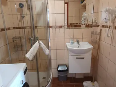 a bathroom with a shower and a sink at U Adama in Wieliczka