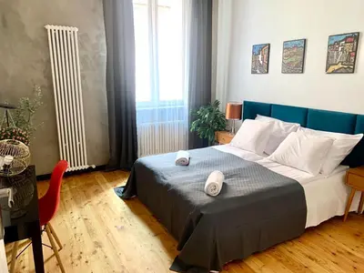 a bedroom with a bed with two towels on it at Florianska Deluxe Apartments with Air Condition in Kraków