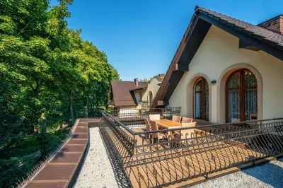 an outdoor patio with a table and chairs at Dworek Skawiński in Skawina