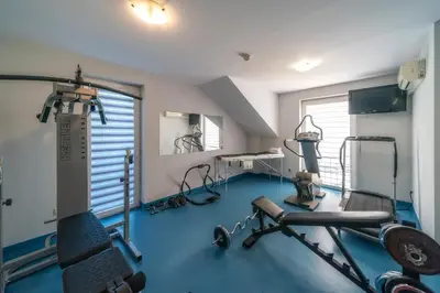 a fitness room with a gym with a treadmill at Dworek Skawiński in Skawina