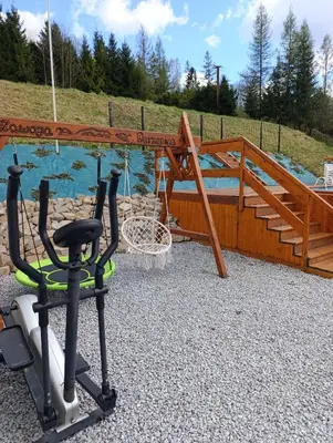 a swing set with a swing at Czesławka in Zawoja