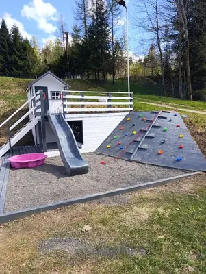 a playground with a ramp and a slide at Czesławka in Zawoja