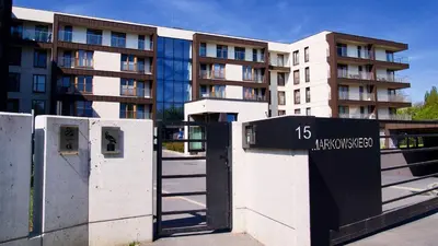a building with a gate in front of a building at Apartament 