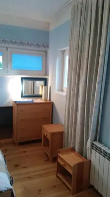 a bedroom with a bed and a dresser and a window at Pokoje Gościnne Lalaj in Bolęcin