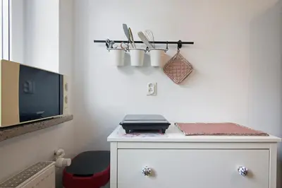 a room with a desk with a laptop on it at Apartament na Fatimskiej in Kraków