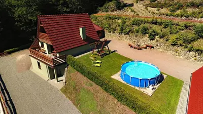 an aerial view of a house in the mountains at Domki Beskid in Rzyki