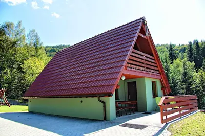 an overhead view of a red building in a field at Domki Beskid in Rzyki