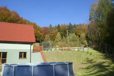an aerial view of a house with red roofs at Domki Beskid in Rzyki