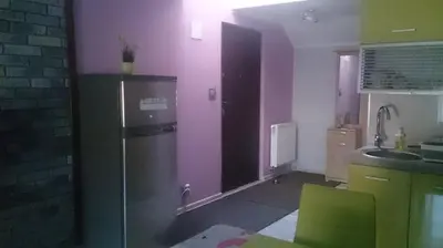 a kitchen with purple walls and a refrigerator at Michałowice Noclegi u Anety in Michałowice