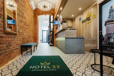 a hotel hallway with a hotel rug on the floor at Hotel 32 Kraków Old Town in Kraków