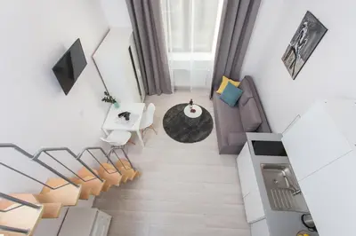 an overhead view of a living room with a couch and chairs at Krakow B&B - Old Town in Kraków