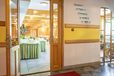a dining room with a table in a restaurant at Hotel Góralski Raj in Nowy Targ