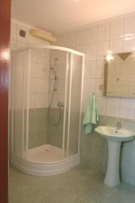 a bathroom with a shower and a sink at Hotel Góralski Raj in Nowy Targ