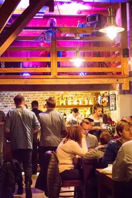 a group of people sitting at a bar at Nasz Młyn in Sufczyn