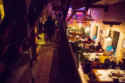an overhead view of a restaurant with people sitting at tables at Nasz Młyn in Sufczyn