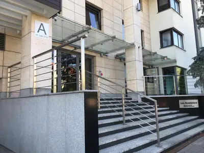 a building with a staircase in front of it at Apartamenty Lea in Kraków