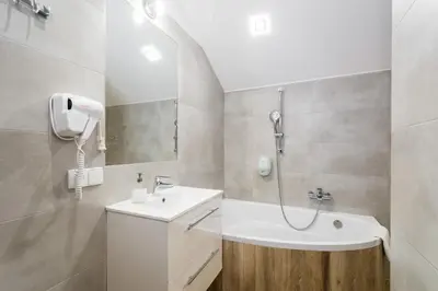 a bathroom with a shower and a sink at Apartamenty Bosacka WAWELOFTS in Kraków