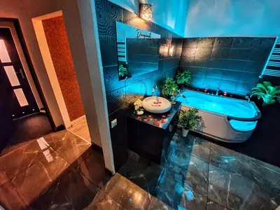 an overhead view of a bathroom with a tub and a sink at Apartament z jacuzzi Kraków in Kraków