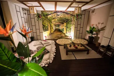 a living room with a view of a garden at Apartament z jacuzzi Kraków in Kraków