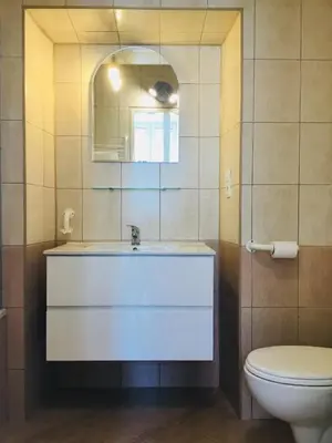 a bathroom with a sink and a toilet at Zamoyskiego in Kraków