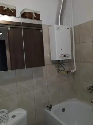 a bathroom with a tub and a toilet and a sink at Apartament Aga1 in Oświęcim