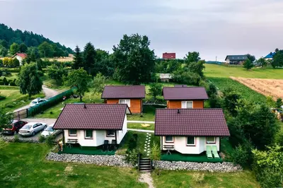 an aerial view of some houses in a field at Idylla in Połom Mały