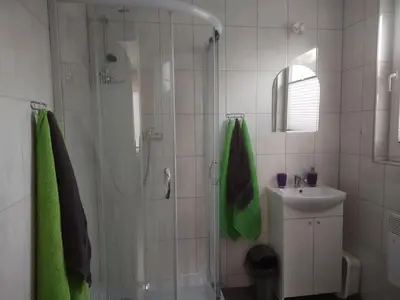 a bathroom with a shower and a sink at Idylla in Połom Mały