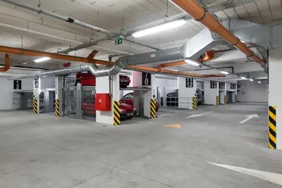 an empty parking garage with cars parked in it at Apartament w centrum Krakowa Ariańska 6 in Kraków