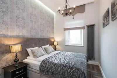 a bedroom with a large bed and a window at Apartament w centrum Krakowa Ariańska 4 in Kraków
