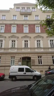 a white van parked in front of a building at Apartament w centrum Krakowa Ariańska 4 in Kraków
